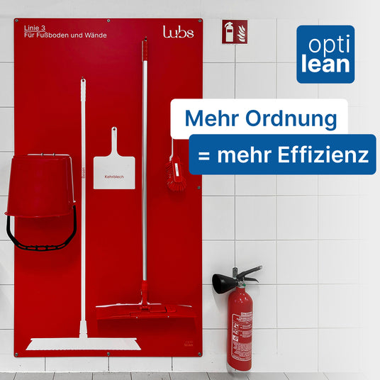 Cleaning station with broom and bucket neatly arranged on the wall with shadows, so it’s immediately noticeable if the broom is missing.